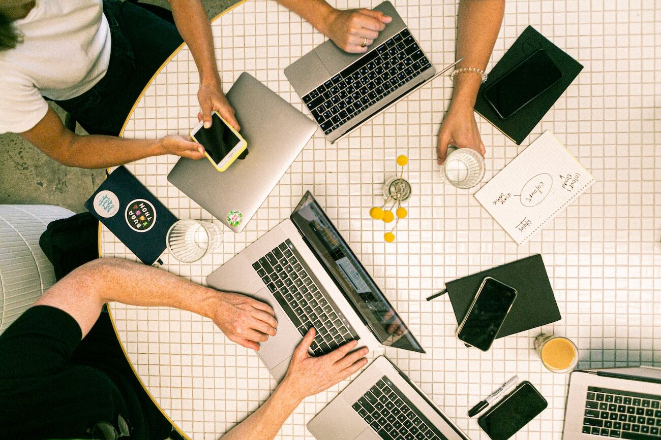 photo of people using laptop